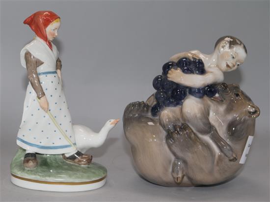 A Royal Copenhagen model of a faun with a bear and grapes and a figure of a girl with a goose (2) H.18.8cm, 17cm